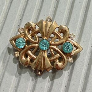 Elegant Gold and Blue Brooch